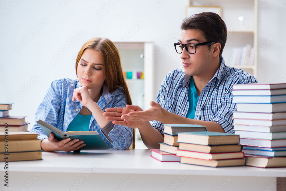 Pair of students studying for university exams Pair of students studying for university exams