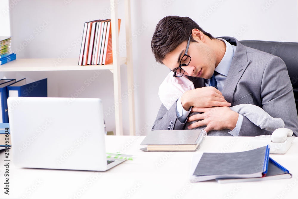 Businessman looking after newborn baby in office Businessman looking after newborn baby in office