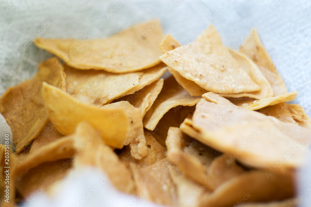 Totopos, typical Mexican snack chips in basket