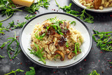 Italian Mushroom risotto with parmesan cheese and wild rocket on top.