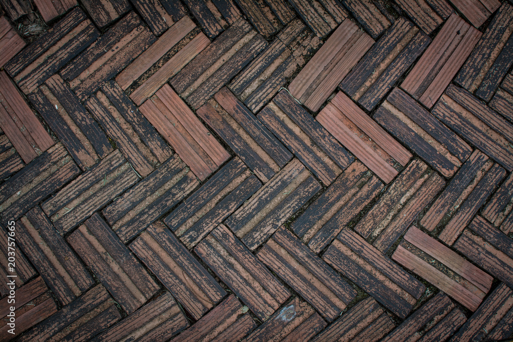 Red brick paving stones on a sidewalk