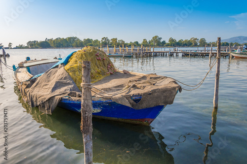 A traditional fishing boat in the sea lagoon of Mesolongi in Greece photo