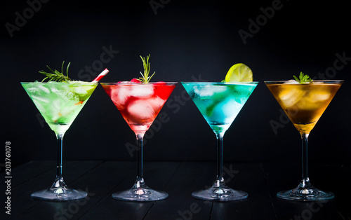 Colorful summer cocktails on black background