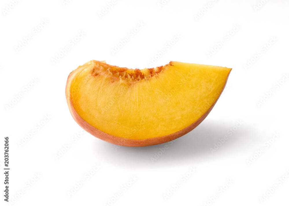 Slice of a peach  against white
