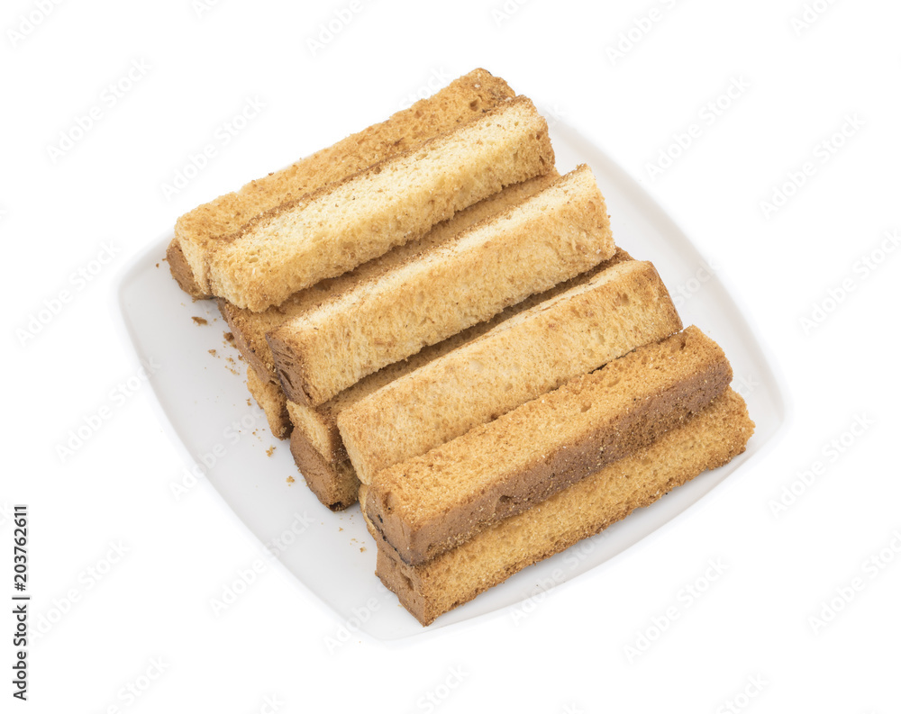 Indian Bakery Food Tea Time Sweet Dry Toast Snack Also Know As Indian Toast Snack, Toasted, Bread, Long Toast, Mawa Toast isolated on White Background Indian Bakery Food Tea Time Sweet Dry Toast Snack Also Know As Indian Toast Snack, Toasted, Bread, Long Toast, Mawa Toast isolated on White Background