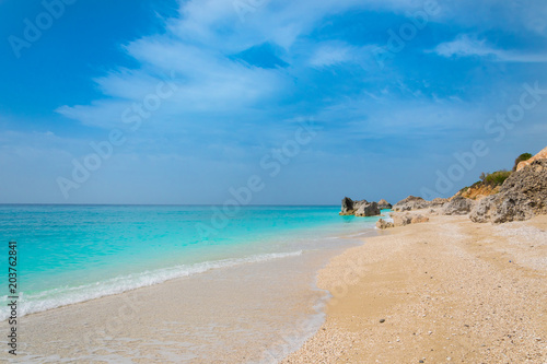 Fototapeta Naklejka Na Ścianę i Meble -  Megali Petra (big rock) beach in Lefkada ionian island in Greece. Endless beach with crystal clear turquoise sea waters 
