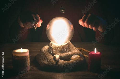 Crystal ball and fortune teller hands. Divination concept. The spiritual seance. Future reading.