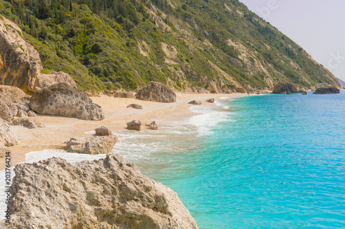 Megali Petra (big rock) beach in Lefkada ionian island in Greece. Beach with crystal clear turquoise sea waters 