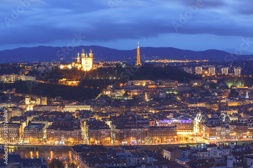 Aerial view of Old town with Fourviere cathedral during evening blue hour in Lyon  France