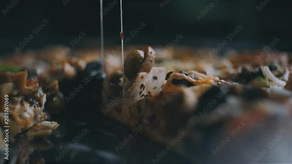 SLO MO DS Lifting a slice of pizza off a plate SLO MO DS Lifting a slice of pizza off a plate