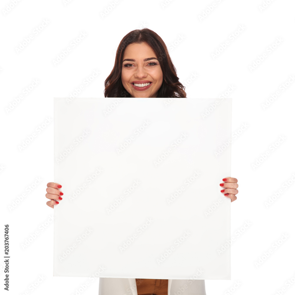 businesswoman with adorable laugh holding a blank board businesswoman with adorable laugh holding a blank board