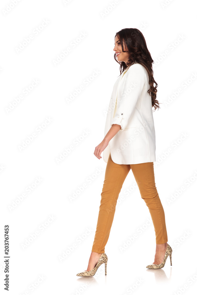 smiling businesswoman walking to side confidently smiling businesswoman walking to side confidently