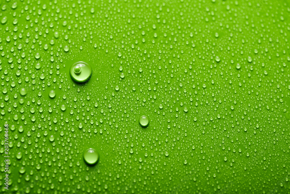 Small and large drops of water on a colored background. Abstract liquid sprays Small and large drops of water on a colored background. Abstract liquid sprays