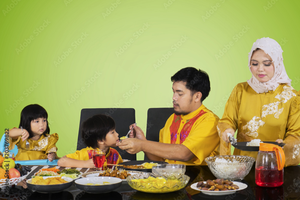 Young woman serving foods before break the fast Young woman serving foods before break the fast