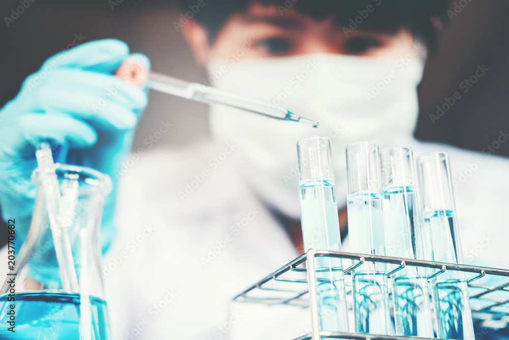 Fototapeta premium Scientist with equipment holding tools during scientific experiment science concept