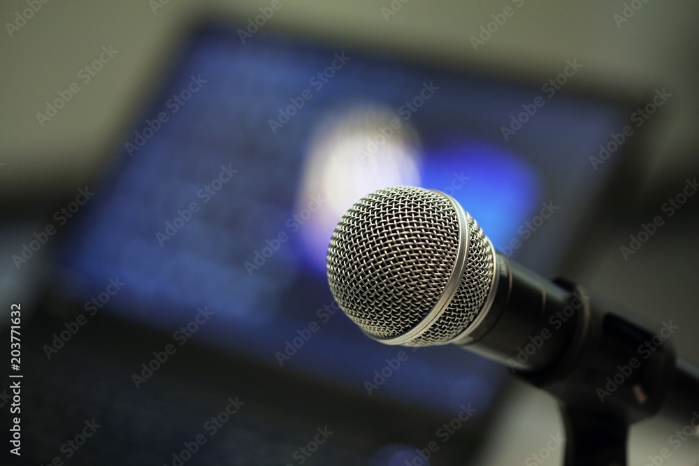 Closeup of microphone in a meeting room; selective focus background. Closeup of microphone in a meeting room; selective focus background.