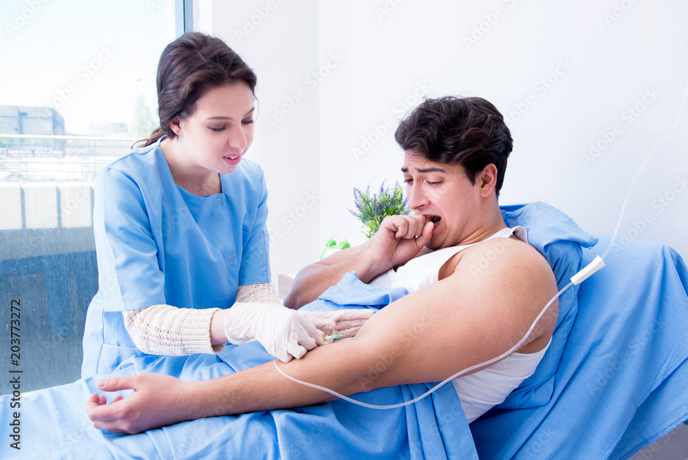 Fototapeta premium Doctor doing medical injection in hospital room