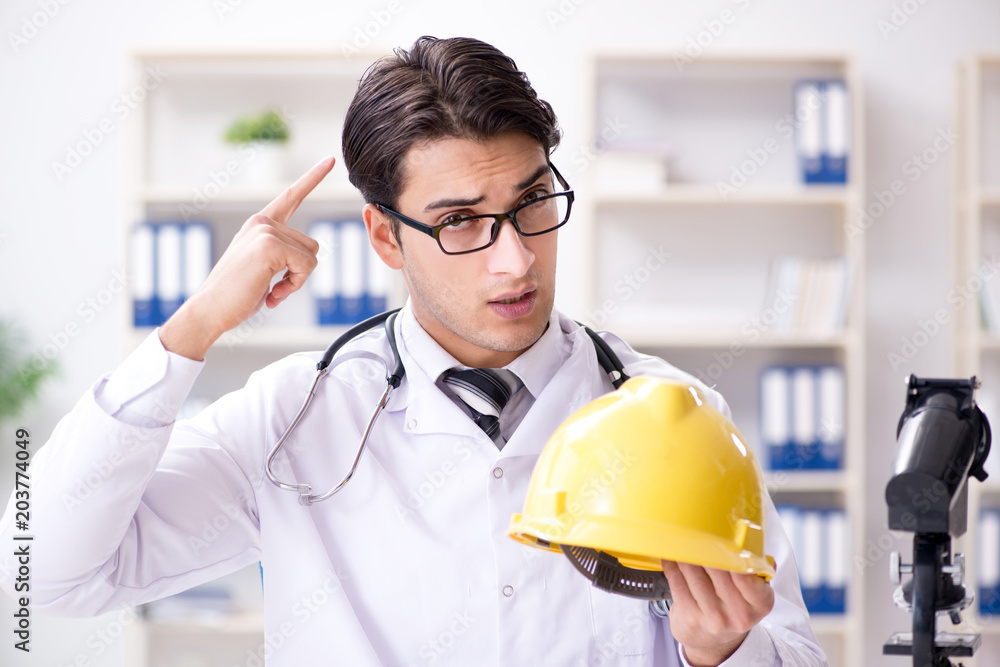 Safety doctor advising about wearing hard hat Safety doctor advising about wearing hard hat