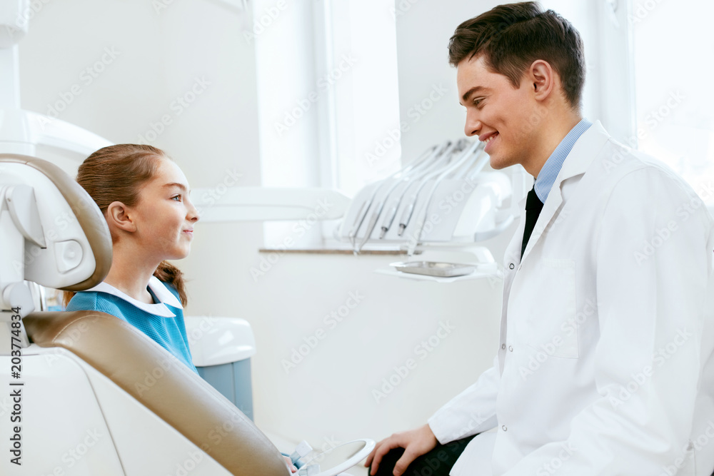 Fototapeta premium Stomatology. Dentistry Doctor And Patient In Dentist Office