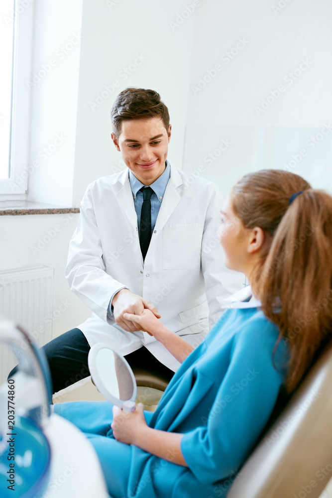 Stomatology. Dentistry Doctor And Patient In Dentist Office Stomatology. Dentistry Doctor And Patient In Dentist Office