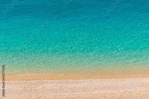 Crystal clear turquoise sea waters of a pebble beach. Porto Katsiki beach in Lefkada ionian island in Greece. 