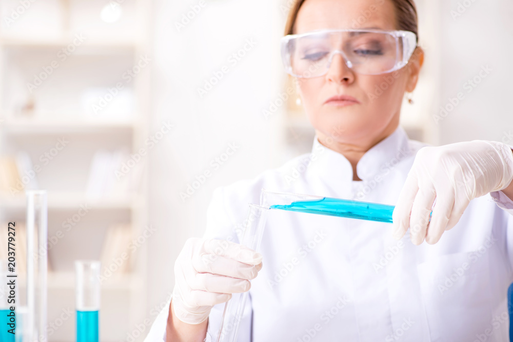 Woman chemist working in hospital clinic lab Woman chemist working in hospital clinic lab