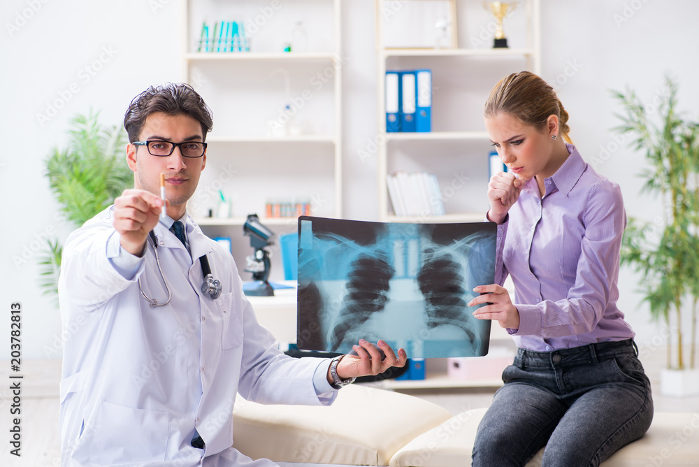 Fototapeta premium Doctor examining x-ray images of patient