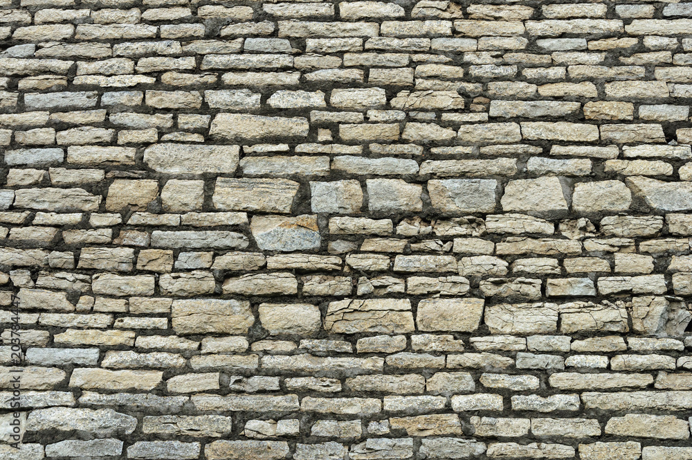 Rough grey stone brick wall Rough grey stone brick wall