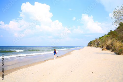 Fototapeta Naklejka Na Ścianę i Meble -  Young lady on the beach in Wolinski Natural Preserve, Pomerania, Poland