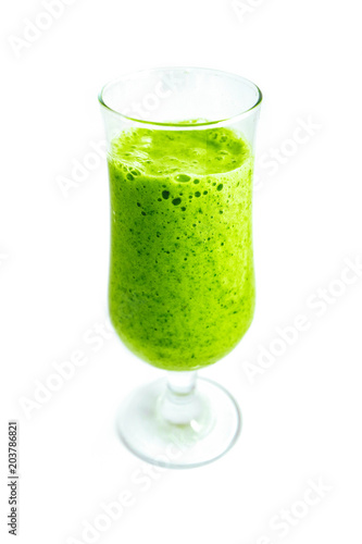 A glass of green organic smoothie drink, isolated on a white background. Healthy diet concept.