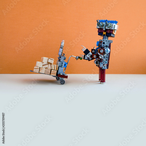 Robotic logistic delivery service concept. Robot moving big wooden blocks with powered pallet jack. Forklift cart mechanism on gray floor, brown wall background. Copy space template