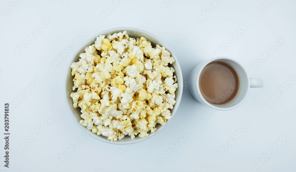 Cocoa and popcorn on a white background.
