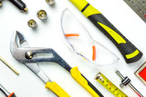 Set of construction tools on white background as wrench, hammer, pliers, socket wrench, spanner, tape measure, electric drill,safety glasses, screwdrive