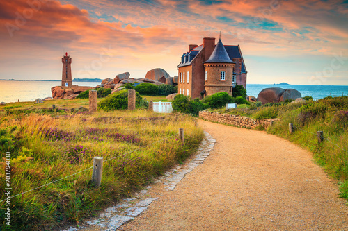 Spectacular walkway and lighthouse in Brittany region, Ploumanach, France, Europe