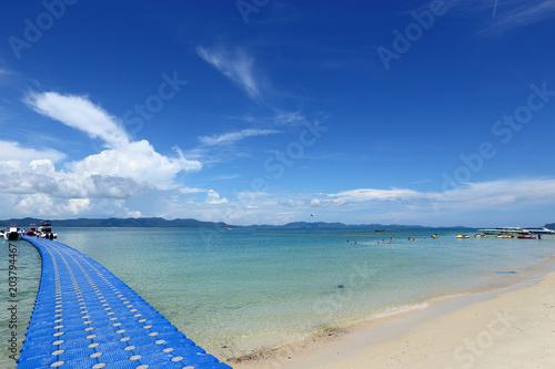 Pack Group of Blue Cubes Float on clear Ocean beautiful beach for tourist to walk from boat photo