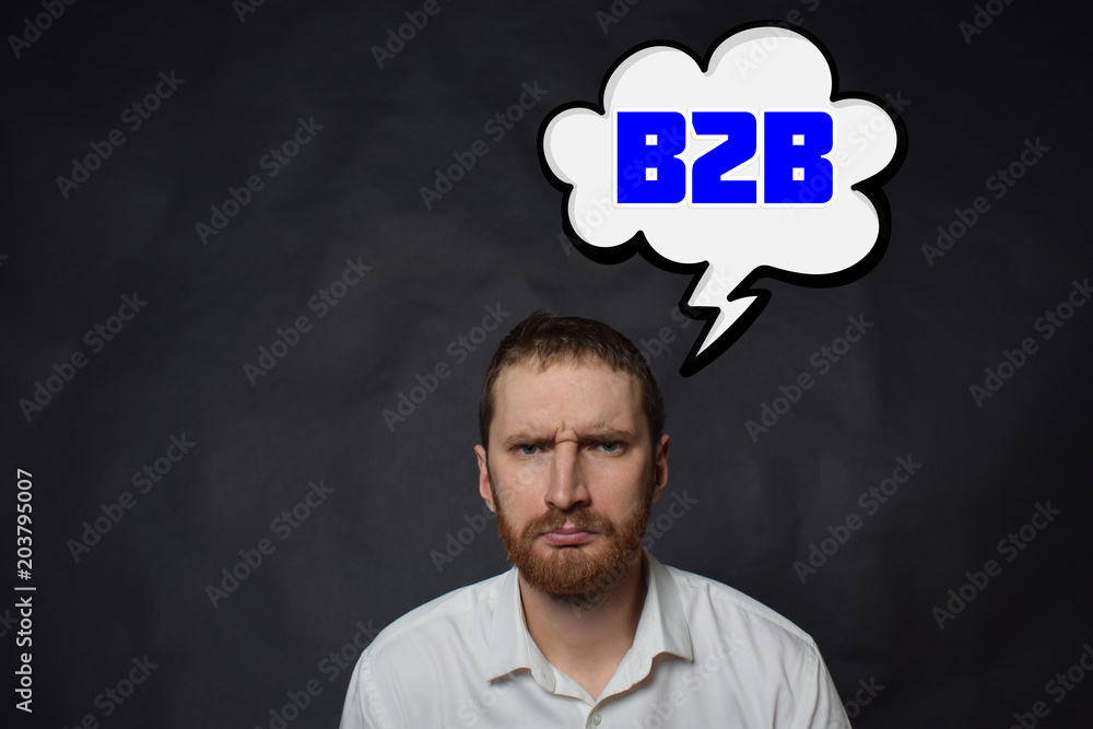 Above the businessman hangs a cloud with the inscription:B2B Above the businessman hangs a cloud with the inscription:B2B