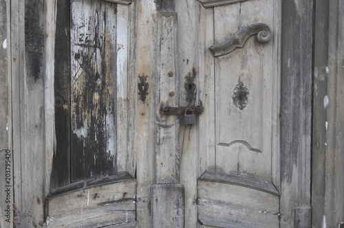 The locked door leading into the old church morgue. Door is very decorative but not maintained for a while.