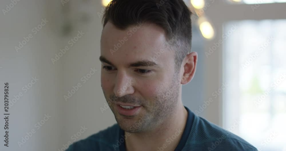 Young man helping critiquing something - close up on face Young man helping critiquing something - close up on face