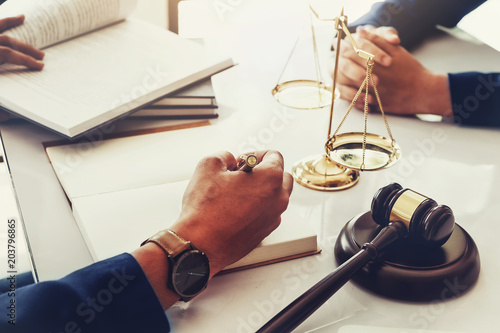 Φωτογραφία law and justice with client concept, Attorney or lawyer judgement lawsuit with holding pen, law book,gavel and scales of justice at table in office