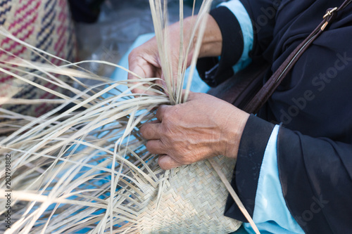 The villagers took bamboo stripes to weave into different forms for daily use utensils of the community’s people in Bangkok Thailand, Thai handmade product. 