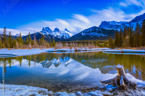 Three Sisters Mountain at Canmore  Alberta  Canada. This photo was taken during the transition between winter and snow season.