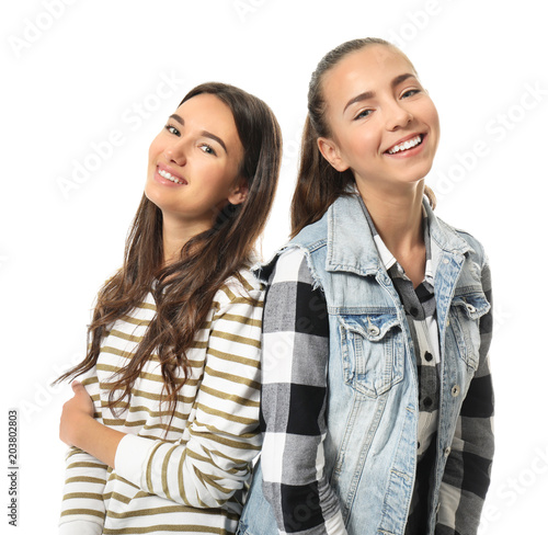 Cute teenage girls on white...