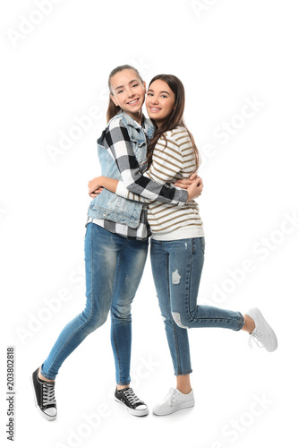 Cute teenage girls on white...