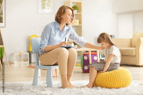 Female psychologist calming...