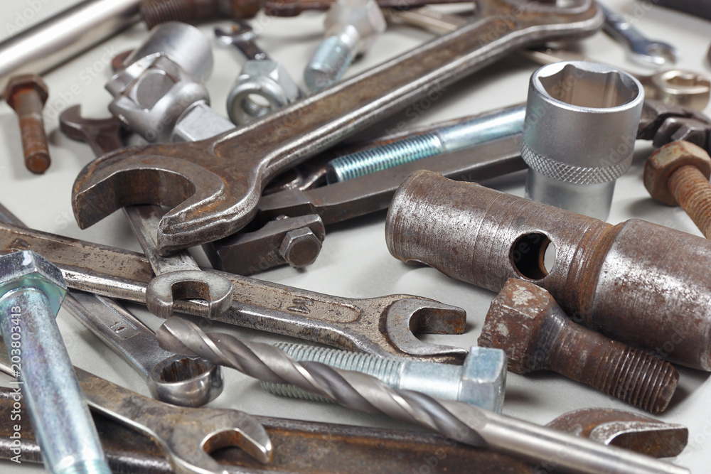 Fototapeta premium Diverse metal tool and parts for repairing machines close up