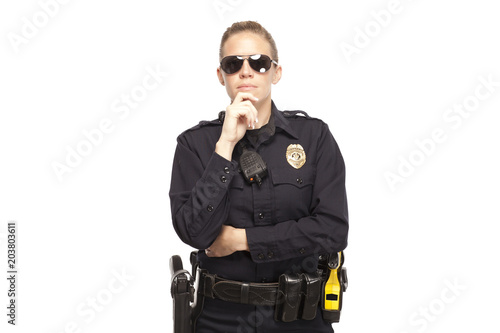 Lady police officer posing with hand on chin