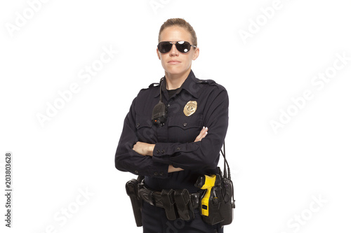 Female police officer posing with arms crossed