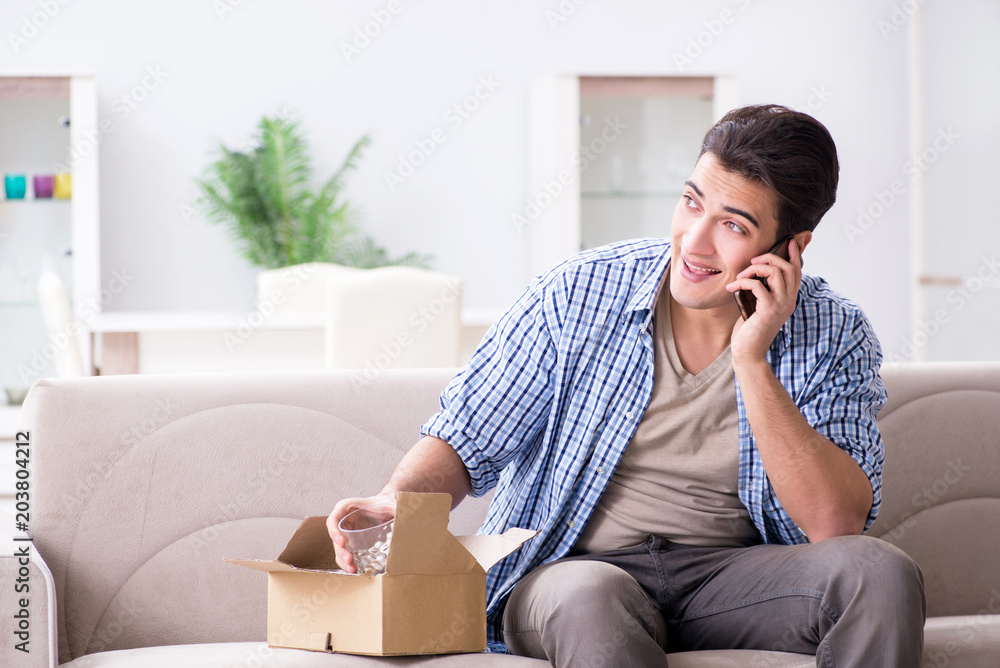 Man receiving parcel at home Man receiving parcel at home