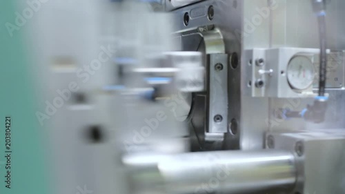 Automatic plastic injection molding machine.