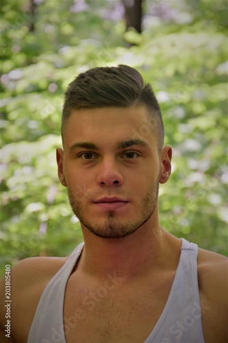 face of a man with delicate facial hair